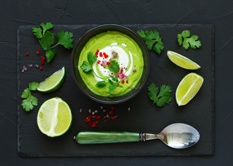Delicate soup with avocado, with lime and cilantro.