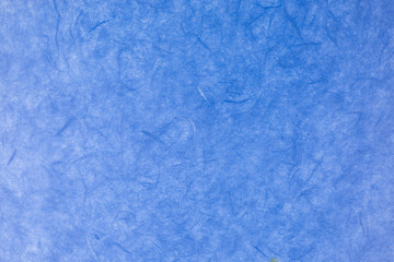 blue paper background with silk fibres