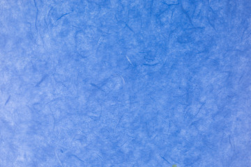 blue paper background with silk fibres