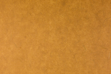 brown paper background with silk fibres