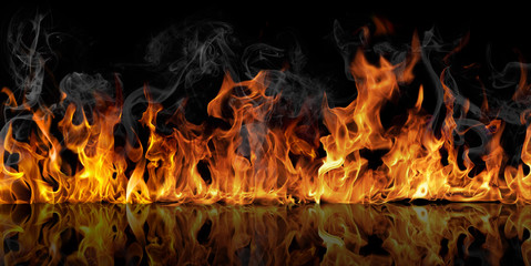 The texture of fire on a black background is reflected in a glossy table. - obrazy, fototapety, plakaty