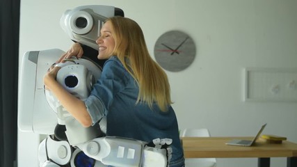 Open minded girl embracing robot tightly