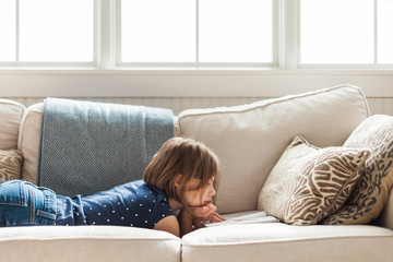 8 year old reading on the sofa