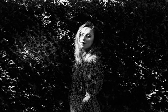Fashion Woman Portrait with a Bush Background . Bw Image