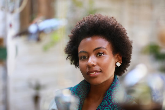 Afro woman looking at something