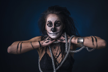 Fototapeta na wymiar Zombie death voodoo scary witch girl, halloween concept, breaking her chains