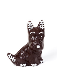 figurine of dog made of chocolate on white background