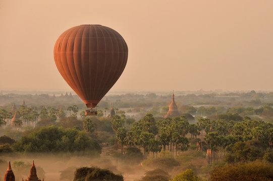 Hot air balloon flying over Bagan at sunrise, Myanmar