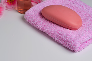 Obraz na płótnie Canvas Soap on a pink towel
