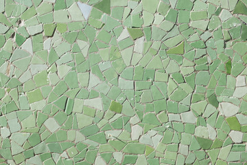 Closeup of green tiles on urban wall