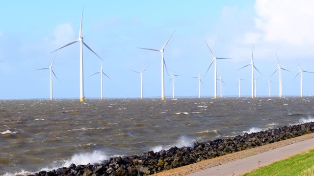 Wind turbines in an October fall storm at the IJsselmeer