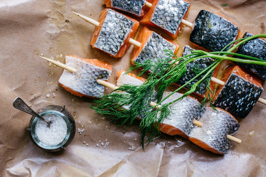 Raw salmon on spit and dill