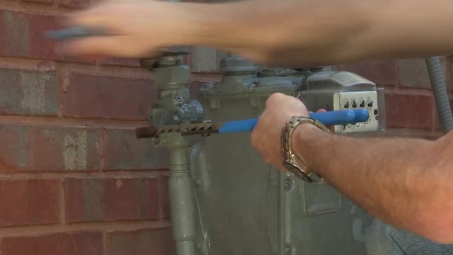 utility worker gas meter