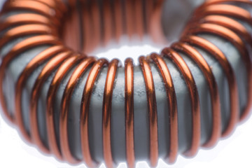 Close up inductor copper coils isolated on white background