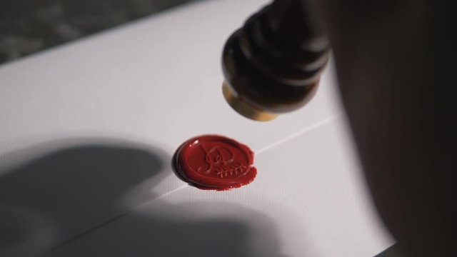 Making the wedding invitation wax seals,  family crest