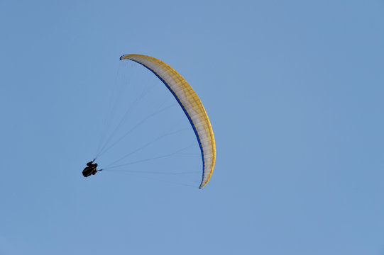 Man paragliding over the countryside