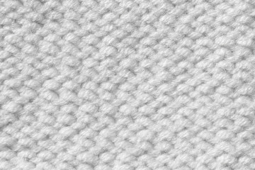 Knitting from woolen threads. Texture for the New Year's postcard. White background for various purposes.