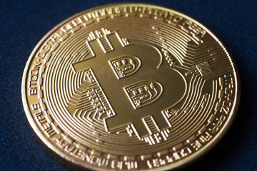 close-up of a golden bitcoin currency