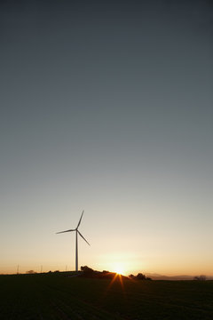 Country scene of windmill at sunrise