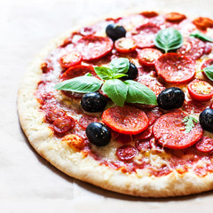 Pizza with cherry tomatoes and ham. Hot Original Italian Pepperoni pizza