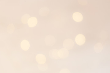 Gold christmas lights background with sparkling bokeh. Abstract defocused boke glittering shimmer.