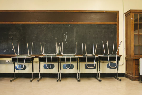 Tables and chairs in classroom