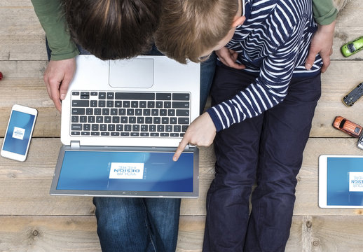 Top View Mockup of Mother and Son with Laptop, Tablet and Smartphone