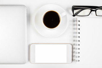 Office desk top with smartphone and other items