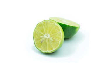 Juicy slice of lime isolated on white background