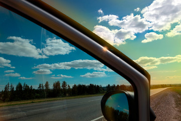 Car stop on the roadside.
Horizontally. Toning. The open door of the car stopped at the side of...