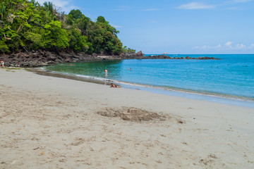 MANUEL ANTONIO, COSTA RICA - MAY 13, 2016: Tourists on a beach in National Park Manuel Antonio, Costa Rica