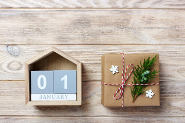 Calendar with date and gift boxes on color background. Christmas concept