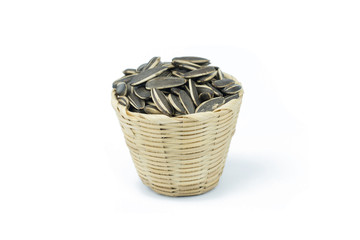 Sun flower seed in bamboo basket isolated on white background