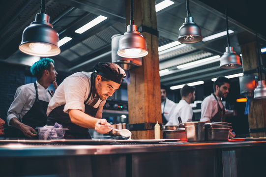 Chef decorating special dishes.