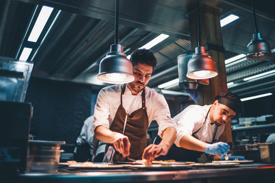 Several cooks working.