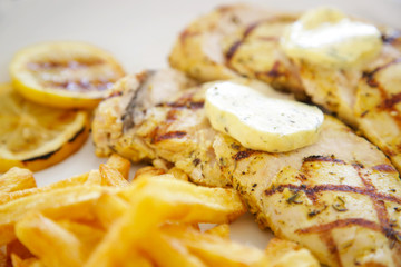 White chicken meat served with french fries