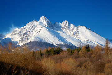 View of the snow-covered rocks Lomnický štít. Slovakia