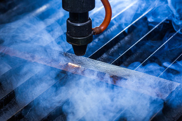 Laser makes engraving on leather belt 