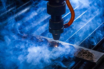 Laser makes engraving on leather belt 