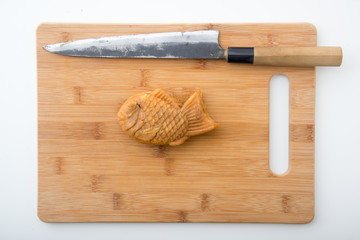 Fototapeta na wymiar taiyaki with sashimi knife