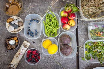 Cooking ingredients, blackberries, blueberries, lemons and different herbs