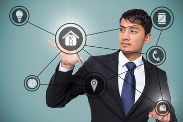 Composite image of unsmiling businessman holding and pointing