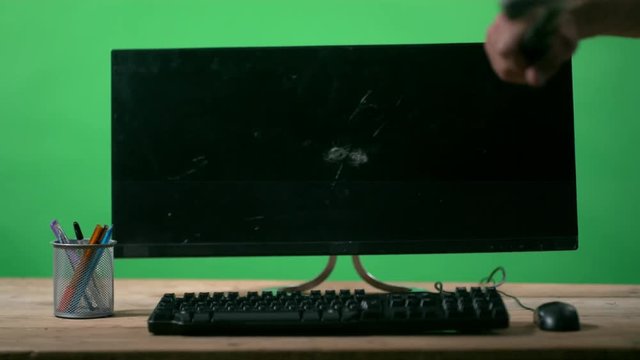  Slowmo unrecognizable angry person smashing computer screen with hammer