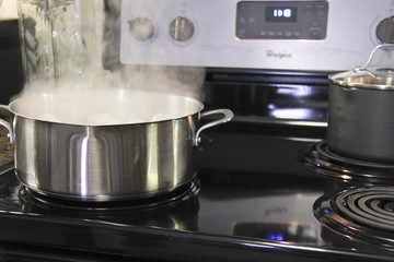 Boiling stainless steal pot on kitchen stove