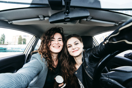 Two Girls Making Selfie In A Car