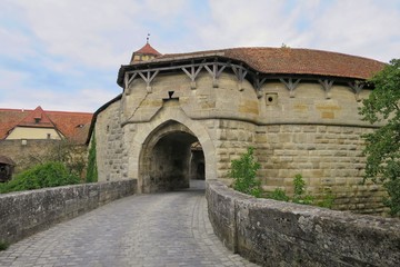 Rothenburg ob der Tauber, Germany with medieval gate and brick walk way in the city wall.