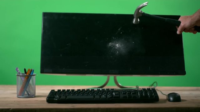  Slowmo unrecognizable angry person smashing computer screen with hammer