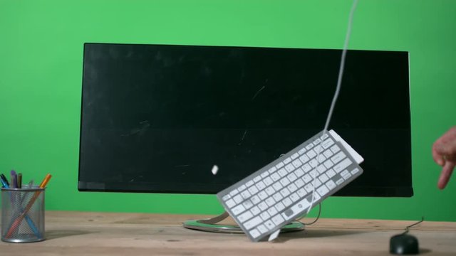  Keyboard thrown at computer screen in a rage, shot in super slow motion