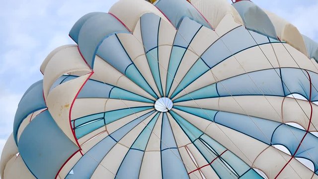 Abstract of blue and white parachute or parasailing in transport and travel concept.