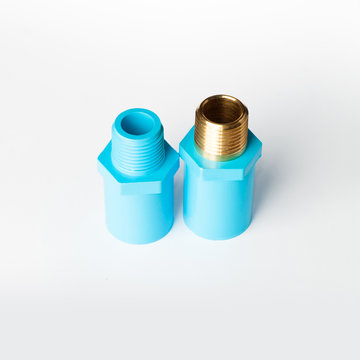 Blue PVC pipe fitting with screw connection on white background